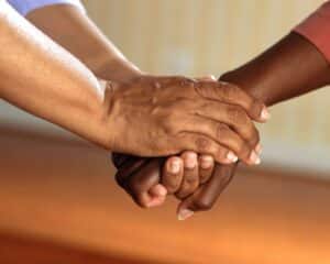 close up of two people holding hands